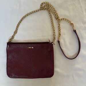 Lodis Burgundy Pebbled Leather Crossbody Bag with Gold Chain